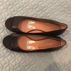 Black peep toe cole Haan slides.